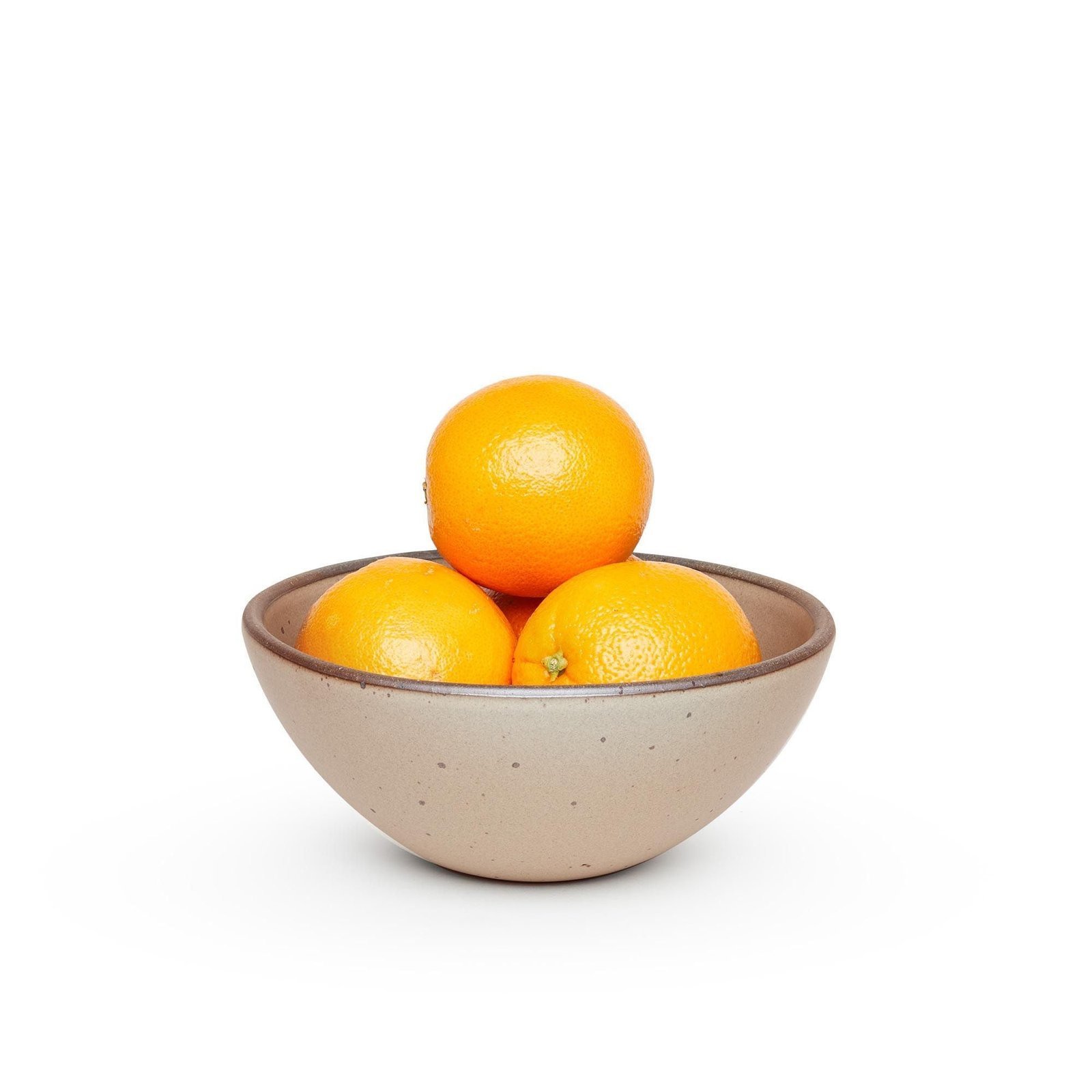 Lunessia soup bowl in Warm Taupe, shown with oranges